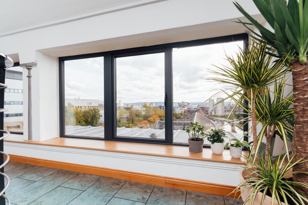 Textured Aluminium Grey Windows with Oak Laminated Cills